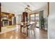 Open dining area showcasing hardwood floors, modern lighting, and adjacent kitchen features at 1667 S Balsam Ct, Lakewood, CO 80232