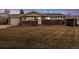 Charming home featuring a brick facade, well-manicured lawn, and inviting front entrance, creating curb appeal at 1667 S Balsam Ct, Lakewood, CO 80232