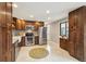 Well-equipped kitchen with stainless steel appliances, custom cabinets, and patterned backsplash at 1667 S Balsam Ct, Lakewood, CO 80232