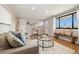 Bright and airy living room with hardwood floors, modern decor, and a comfortable seating area at 1667 S Balsam Ct, Lakewood, CO 80232