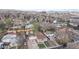 Aerial view showcases the home's location within a residential neighborhood, with nearby city views at 415 S Parfet St, Lakewood, CO 80226