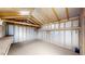 Unfinished basement with exposed rafters and wooden beams at 415 S Parfet St, Lakewood, CO 80226
