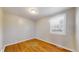 Bedroom with hardwood floors and a window at 415 S Parfet St, Lakewood, CO 80226