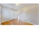 Bedroom with hardwood floors and an open doorway at 415 S Parfet St, Lakewood, CO 80226