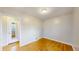 Bedroom with hardwood floors and an open doorway at 415 S Parfet St, Lakewood, CO 80226