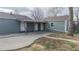 Exterior showing a covered walkway from the house to the detached garage, providing convenient access at 415 S Parfet St, Lakewood, CO 80226