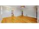 Open living room features hardwood floors, natural light, and access to kitchen at 415 S Parfet St, Lakewood, CO 80226
