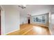 Bright open living room with hardwood floors and windows providing lots of natural light at 415 S Parfet St, Lakewood, CO 80226