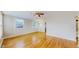 Bright living room with hardwood floors, plenty of natural light and a ceiling fan at 415 S Parfet St, Lakewood, CO 80226