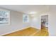 Dining area adjacent to open living room boasts hardwood floors and natural light at 415 S Parfet St, Lakewood, CO 80226