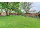 Large grassy backyard featuring a playset, shed and a well-maintained fence at 10527 Pierson Cir, Westminster, CO 80021