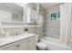 Neutral bathroom featuring a shower over tub, updated tiling and a marble counter sink at 10527 Pierson Cir, Westminster, CO 80021