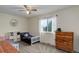 Bright bedroom with carpet and an abundance of natural light from the large window at 10527 Pierson Cir, Westminster, CO 80021