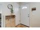 Bright entryway with wooden accents, a mirror, and a white front door with decorative window at 10527 Pierson Cir, Westminster, CO 80021