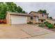 Two-story home featuring a well-manicured lawn, an attached two-car garage, and neutral-colored siding at 10527 Pierson Cir, Westminster, CO 80021