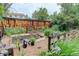 A backyard garden features multiple raised beds and a variety of plants and flowers at 10527 Pierson Cir, Westminster, CO 80021