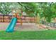 A backyard playground features a slide, swings, and sandbox, perfect for Gathering fun at 10527 Pierson Cir, Westminster, CO 80021