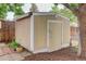A clean shed features a neutral color scheme and is situated on a well-maintained property at 10527 Pierson Cir, Westminster, CO 80021