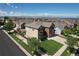 Aerial view of home featuring a landscaped front yard, deck, and mountain views at 11951 Singing Winds St, Parker, CO 80138
