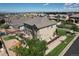 Aerial view of the home's backyard featuring a deck with furniture, playground, and landscaped yard at 11951 Singing Winds St, Parker, CO 80138