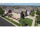 Aerial view of the home's backyard featuring a playground, wooden fence, and landscaped yard at 11951 Singing Winds St, Parker, CO 80138