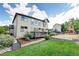 Beautiful backyard includes a deck, playground, and green lawn at 11951 Singing Winds St, Parker, CO 80138