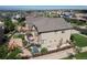 Aerial view of the home's backyard featuring a deck with furniture, playground, and landscaped yard at 11951 Singing Winds St, Parker, CO 80138