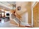 Inviting foyer with a staircase, tile flooring, and views of the living area at 11951 Singing Winds St, Parker, CO 80138