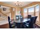 Bright home office featuring a bay window, hardwood floors, and a spacious layout at 11951 Singing Winds St, Parker, CO 80138