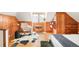 Bedroom featuring wood paneled walls, wood floors, seating area with rocker, and bright, airy window at 250 S Ogden St, Denver, CO 80209