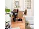 Cozy dining room with modern round table, stylish chairs, and a built-in china cabinet at 250 S Ogden St, Denver, CO 80209