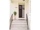 Inviting front porch with a classic door and decorative plant, creating a warm welcome at 250 S Ogden St, Denver, CO 80209