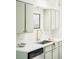 Modern kitchen with quartz countertops, stainless steel sink, and bright cabinets at 250 S Ogden St, Denver, CO 80209