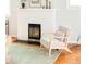 Cozy living room featuring a fireplace and a stylish chair, creating a comfortable atmosphere at 250 S Ogden St, Denver, CO 80209