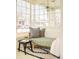 Bright sunroom with cushioned bench, stylish pillows, and lots of natural light at 250 S Ogden St, Denver, CO 80209