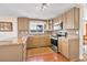 Modern kitchen with stainless steel appliances, granite countertops, and tile backsplash at 12196 Grape St, Thornton, CO 80241