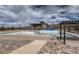 Community pool under maintenance with surrounding landscaping at 11099 Pastel Pt, Parker, CO 80134