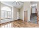 Living room with hardwood floors, vaulted ceiling, and a built-in window seat at 7711 Xavier Ct, Westminster, CO 80030