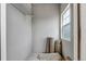 A walk-in closet with storage shelves and a window providing natural light at 9387 Ashbury Cir # 203, Parker, CO 80134