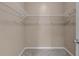 A walk-in closet with storage shelves for organization at 9387 Ashbury Cir # 203, Parker, CO 80134