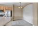 Eat in dining area with modern light fixture at 9387 Ashbury Cir # 203, Parker, CO 80134