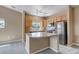 Bright kitchen with stainless steel appliances and granite countertops at 9387 Ashbury Cir # 203, Parker, CO 80134