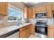 Bright kitchen featuring stainless appliances and natural light at 9387 Ashbury Cir # 203, Parker, CO 80134