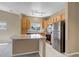 Bright kitchen with stainless steel appliances and granite countertops at 9387 Ashbury Cir # 203, Parker, CO 80134