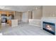 Open living space featuring a kitchen with stainless appliances and a fireplace for a warm, inviting ambiance at 9387 Ashbury Cir # 203, Parker, CO 80134