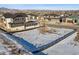 Aerial view of a vacant lot in a residential area showcasing the community, mountain views, and open space views at 945 Saint Andrews Ln, Louisville, CO 80027