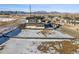 Aerial view of a vacant lot next to modern home in a residential area showcasing the community, mountain views, and open space views at 945 Saint Andrews Ln, Louisville, CO 80027