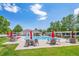 A well-maintained community pool has lawn chairs and seating areas with lush landscaping at 945 Saint Andrews Ln, Louisville, CO 80027