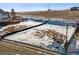 View of a new home site, prepped and ready for construction, with a partially snow covered lot at 945 Saint Andrews Ln, Louisville, CO 80027
