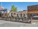 Charming restaurant exterior with outdoor seating, planters, and a cozy, inviting atmosphere at 945 Saint Andrews Ln, Louisville, CO 80027
